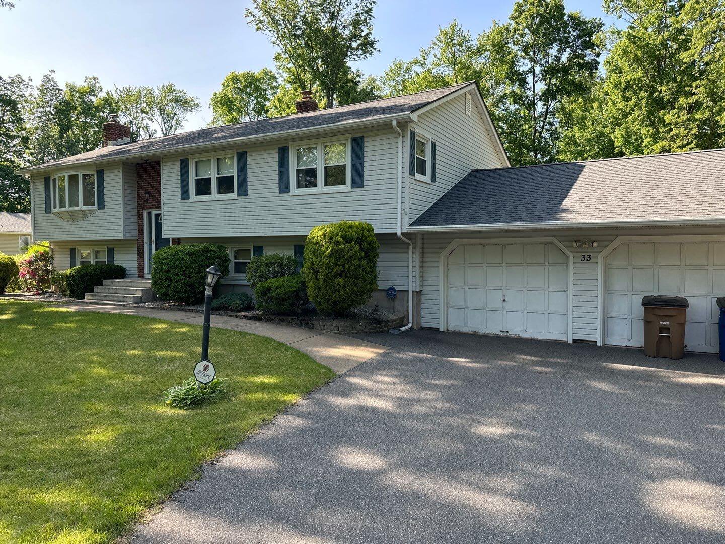 A split level home with new roofing and siding in Plantsville, CT